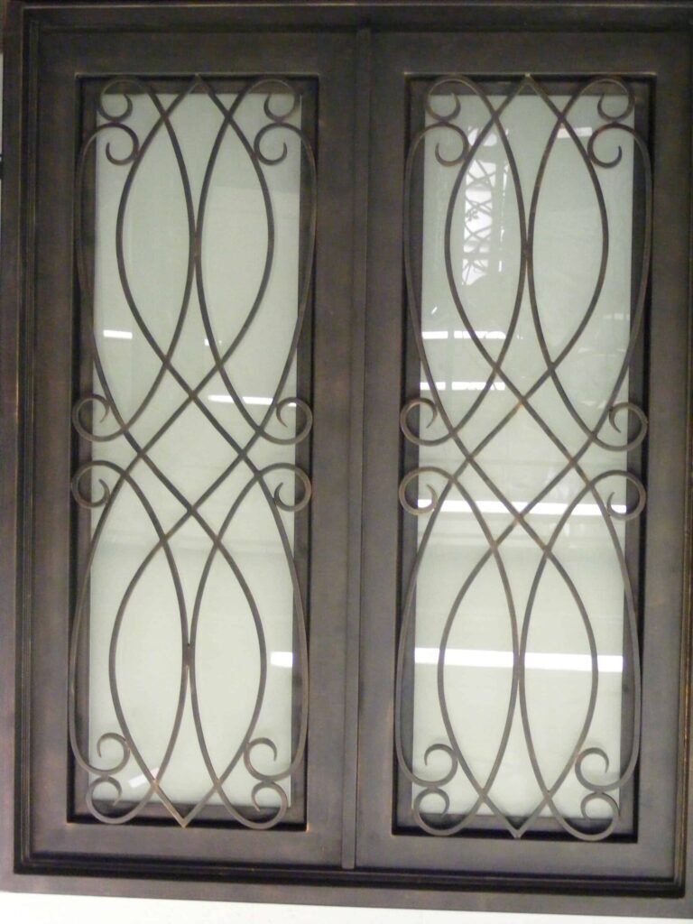 Contemporary wrought iron door EL1161 MCD with lattice scroll design and frosted glass, handcrafted for modern elegance.