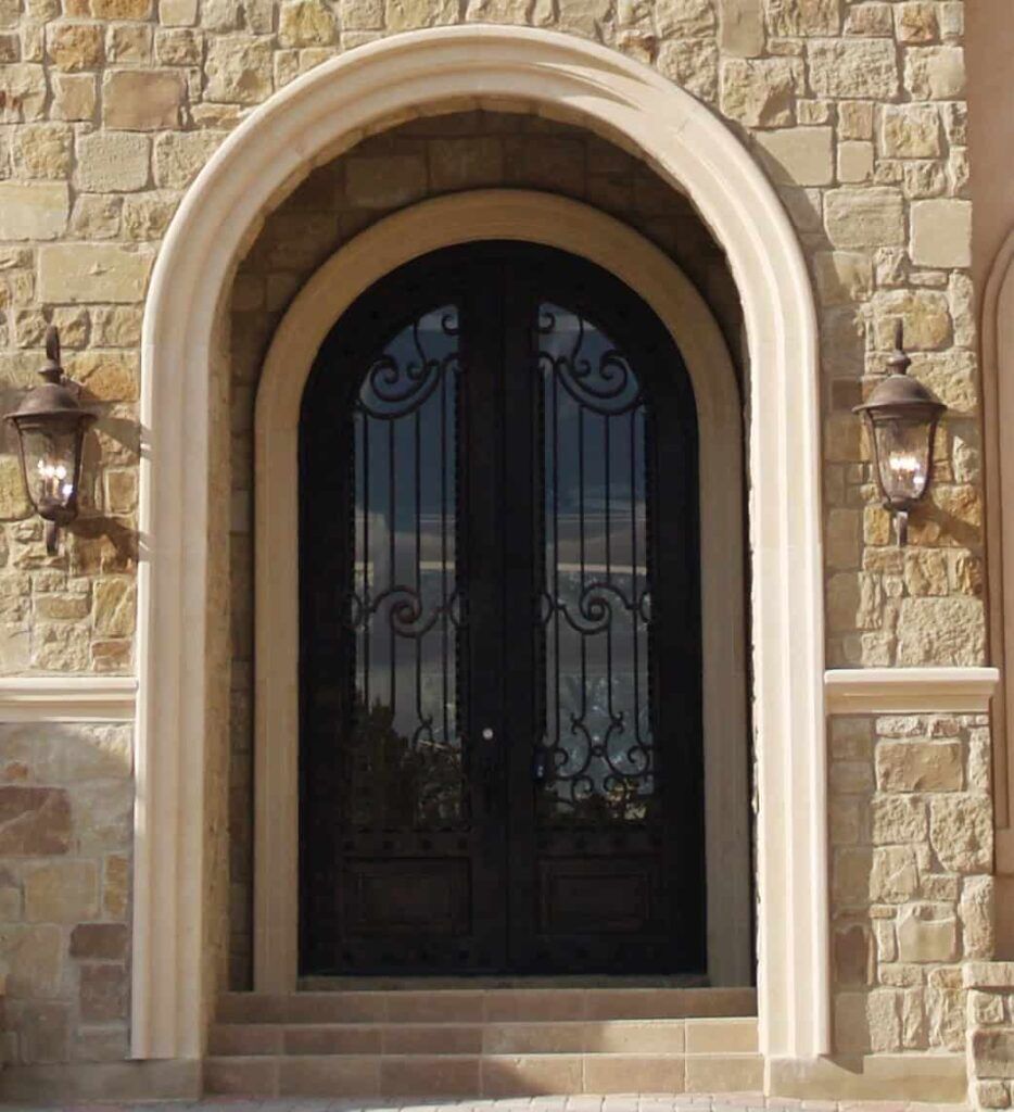 Double arched wrought iron door EL1074 MCD with scroll panels and glass, handcrafted for elegance and durability.