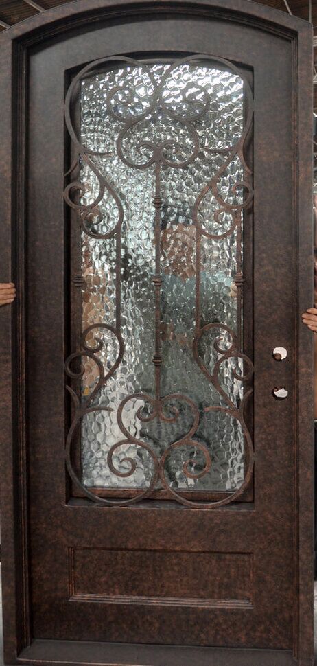 EL997 MCD single wrought iron door with decorative scroll grille and hammered insulated glass panel