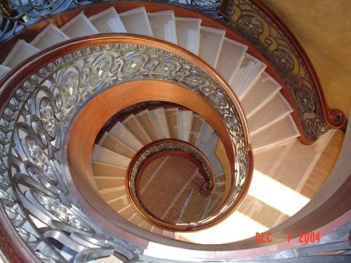 curved spiral staircase wrought iron railing elegant interior design R101 MCD