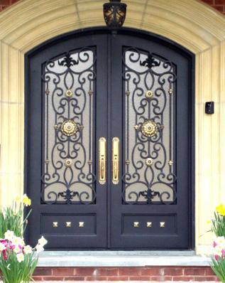 Double wrought iron door EL1109 MCD with bronze patina finish and scrollwork, hand-forged for luxury appeal.