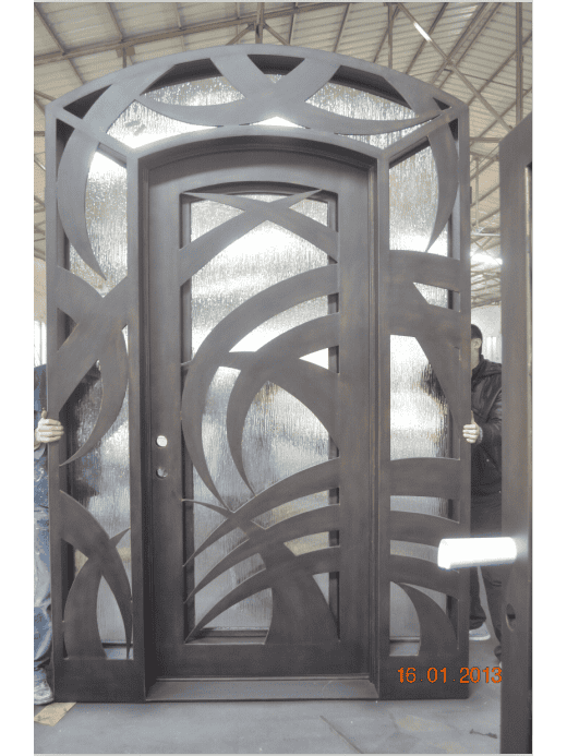 Arched wrought iron door EL1029 MCD with decorative glass panels, handcrafted for durability and elegance.
