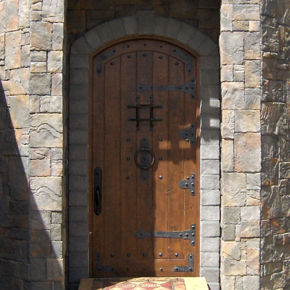 arched wood entry door iron clavos EH564 MCD