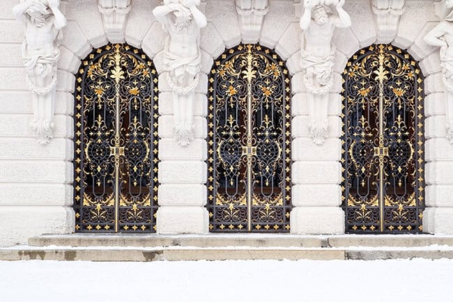 Ornate wrought iron gate with Baroque scrollwork and decorative gold detailing G133 MCD