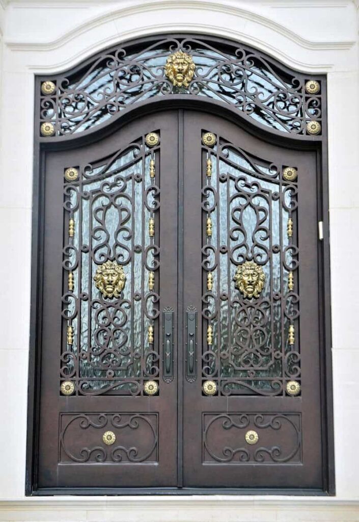 Ornate double wrought iron door EL1136 MCD with rosette accents, intricate scrollwork, decorative glass and detailed panels.