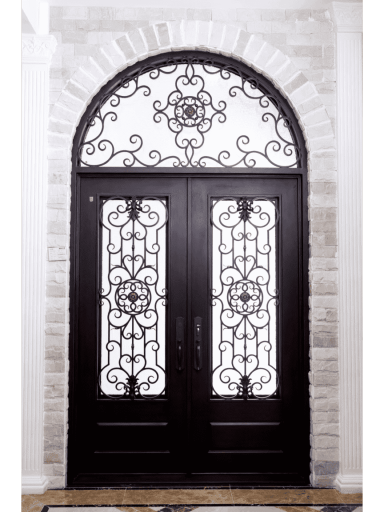 Arched double wrought iron door EL1138 MCD with circular medallions, symmetrical scrollwork and ornamental transom.