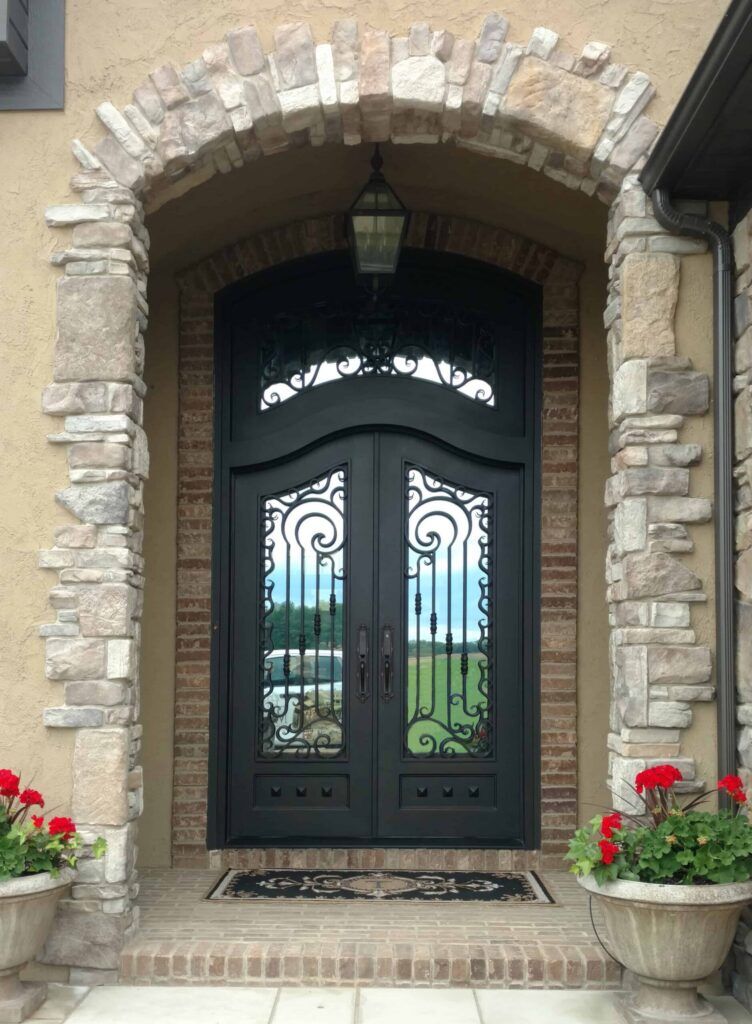 Double arched wrought iron door with crown scroll transom EL1059 MCD handcrafted by Monarch Custom Doors.