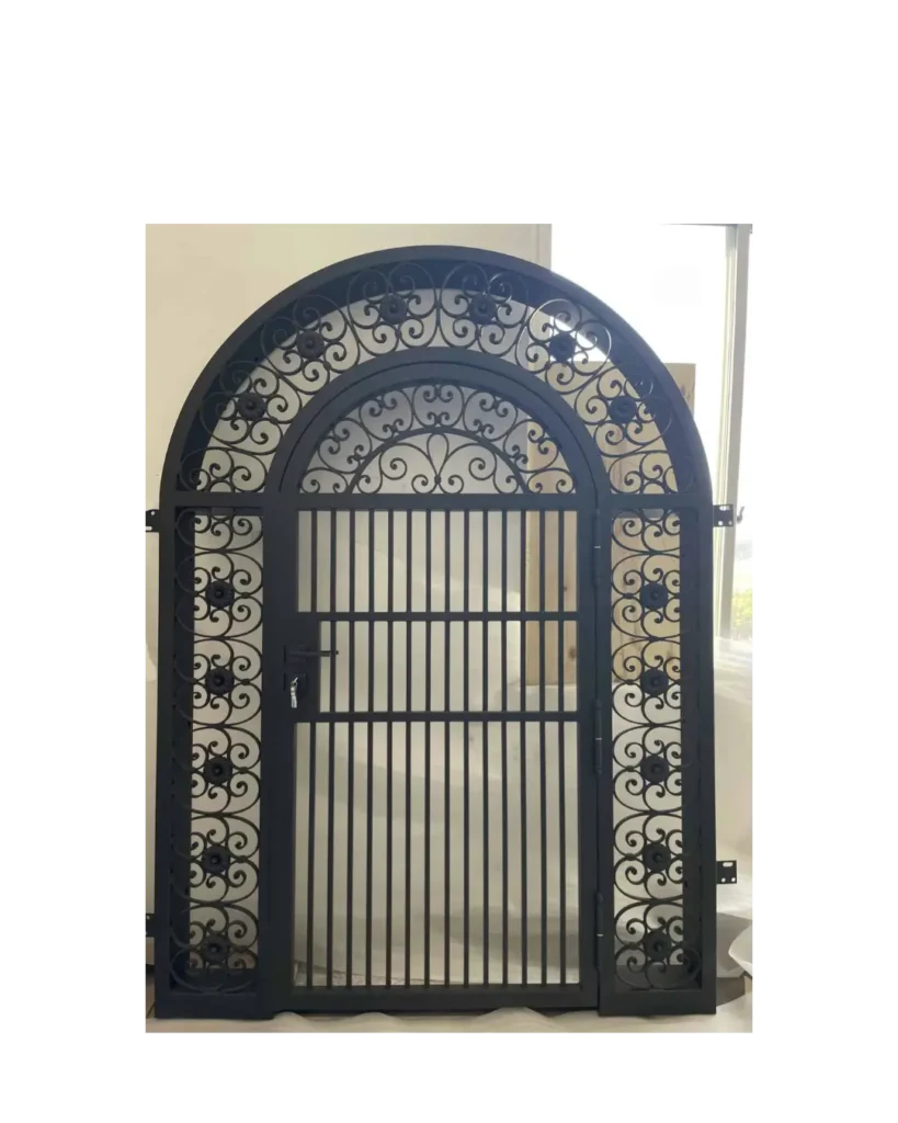 Arched wrought iron gate with decorative scrollwork and vertical security bars G103 MCD