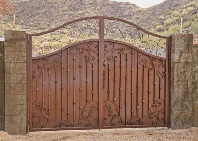 Tuscan-inspired wrought iron gate with decorative scrollwork and privacy panels G135 MCD