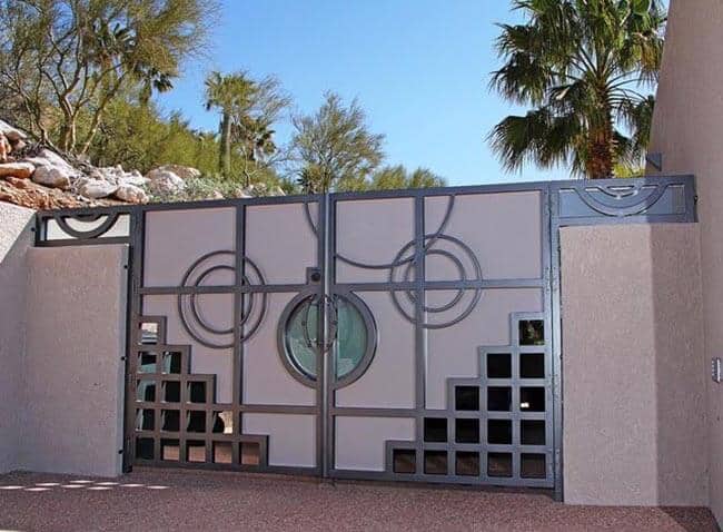 Modern wrought iron gate with geometric patterns and circular accent detailing G134 MCD