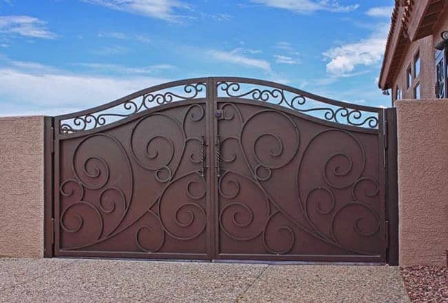 Contemporary wrought iron gate with flowing scrollwork and privacy panel design G136 MCD