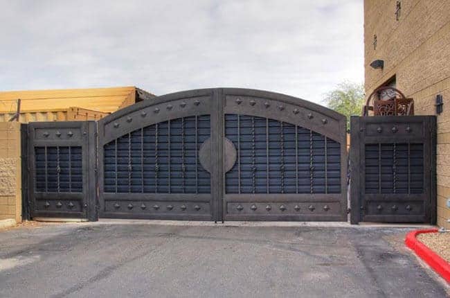 Modern wrought iron gate with industrial privacy panels and horizontal slat detailing G139 MCD