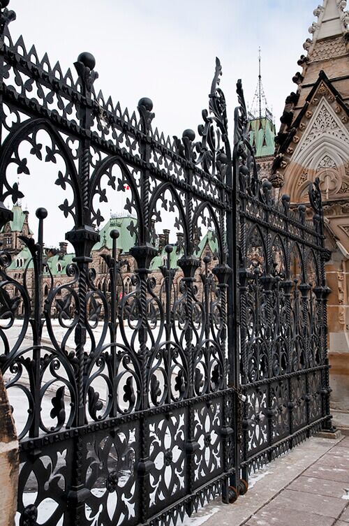 Ornate Gothic-inspired wrought iron gate with decorative scrollwork and iron detailing G153 MCD