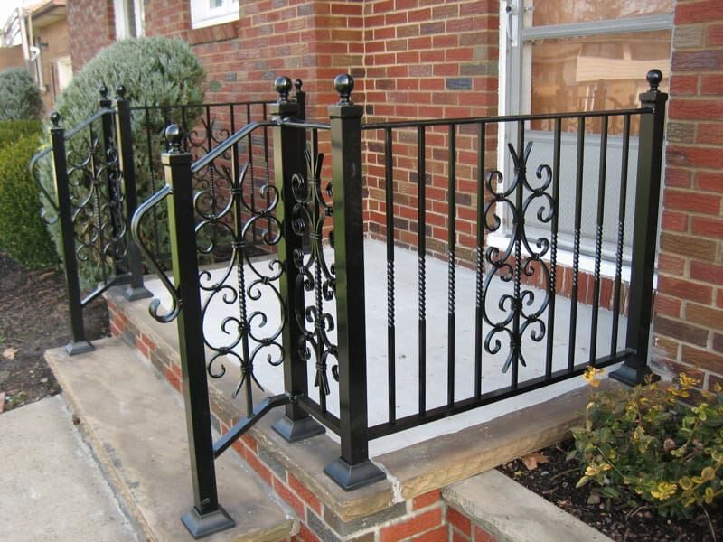 vertical bar wrought iron porch railing with scroll accents exterior steps R910 MCD