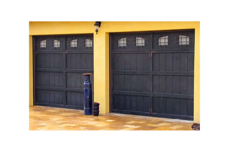 old english style iron garage doors GD4012 MCD with vertical panels and decorative window inserts by Monarch Custom Doors