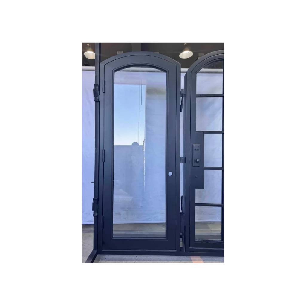 EL1603 MCD arched single wrought iron door with full-height insulated glass panel and slim steel frame