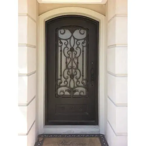 Single arched wrought iron door EL998 MCD with ornate scrollwork and rosettes, hand-forged for strength and artistry.