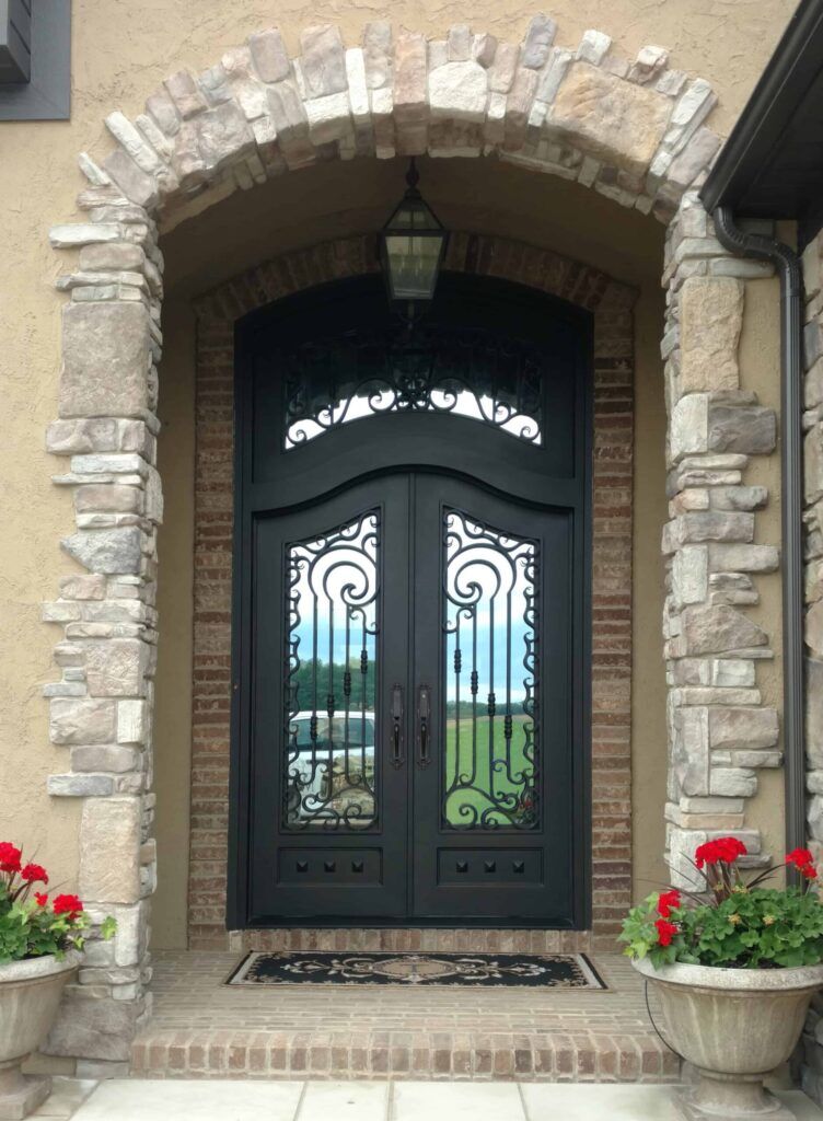 EL1059 MCD Exquisite hand-crafted wrought iron door with scroll panels, combining durability, elegance, and lasting security.