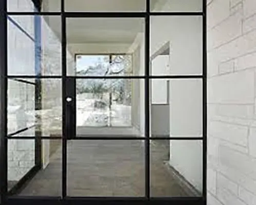Contemporary wrought iron door EL1131 MCD with glass grid panels, hand-forged for modern elegance and strength.