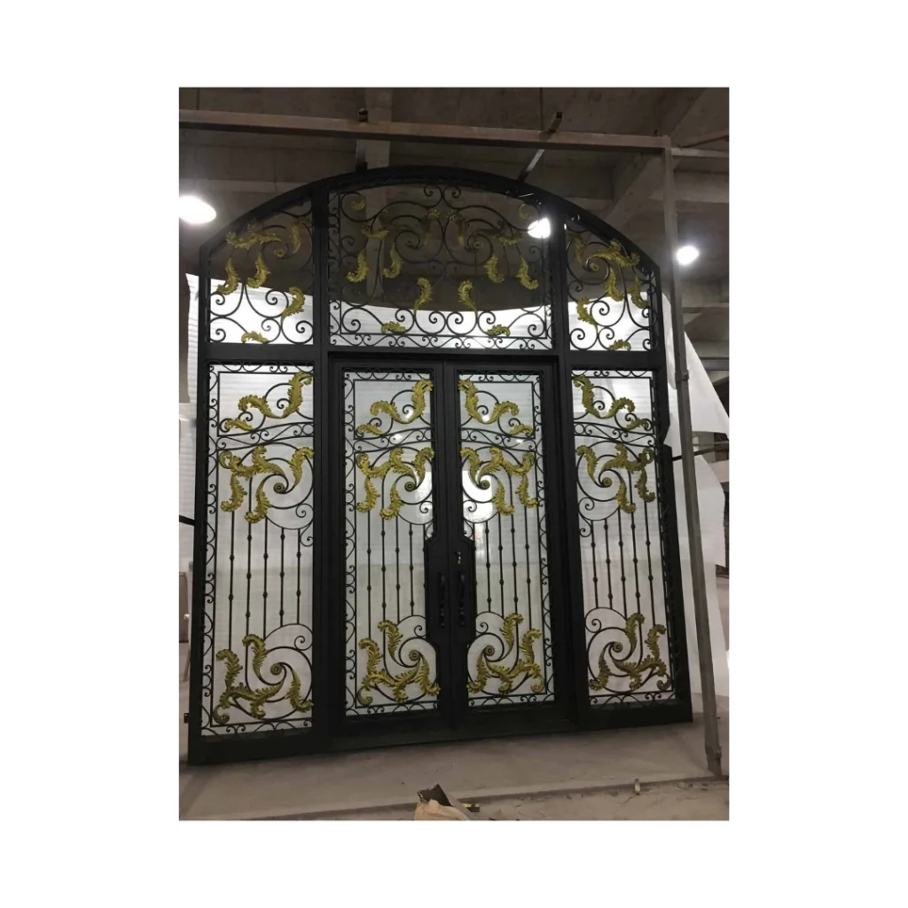 Grand arched wrought iron double door with gold scrollwork and clear glass panels