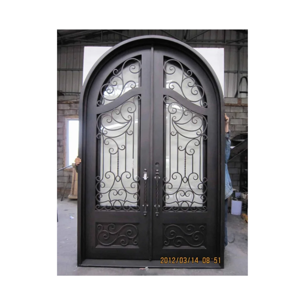 Double arched wrought iron door EL1103 MCD with scrollwork and eyebrow arch transom, hand-forged for elegance and strength.