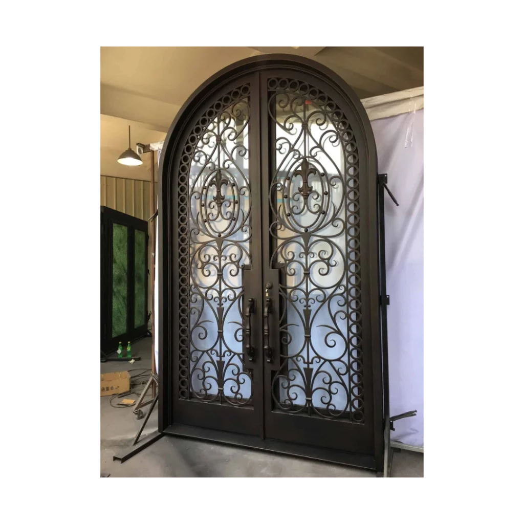 Ornate double arched wrought iron door EL1132 MCD with scrollwork and eyebrow arch, hand-forged for artistry and strength.